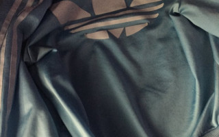 Is this Adidas Jacket Blue and White or Black and Brown?