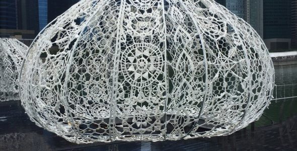 Crochet installations resembling sea urchins play with light
