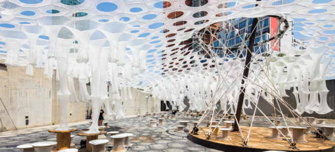 Lumen: photo-luminescent canopy that reacts to light, heat and movement