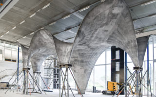 An ultra-thin, sinuous concrete roof made with new design and fabrication methods