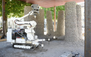 Robot builds stable structures with loose stones and string