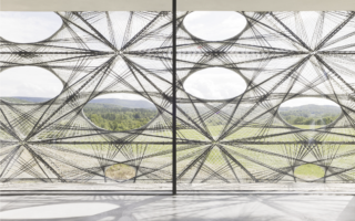 A facade robotically woven of carbon and glass fibres