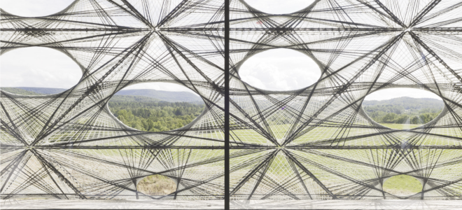 A facade robotically woven of carbon and glass fibres