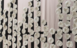 A room divider made of wood and eggshell ceramics