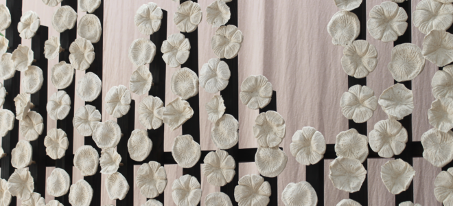 A room divider made of wood and eggshell ceramics