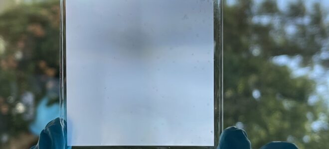 A transparent metamaterial for energy-efficient light and temperature regulation